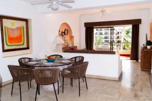 a living room with a dining room table and chairs at Amazing Ocean View in Puerto Vallarta