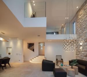 a living room with a couch and a table at Villa Stara in Selca