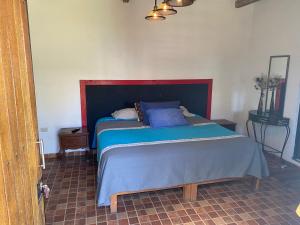 A bed or beds in a room at Villa IXCANUL