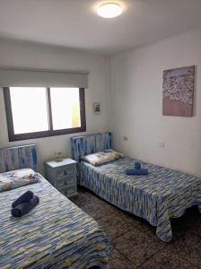 Postel nebo postele na pokoji v ubytování CASA LEO