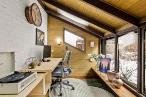 an office with a desk in a tiny house at BoHo Oasis - Hot Tub - Peloton - Walk to Tennyson in Denver