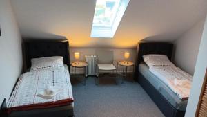 En eller flere senge i et værelse på BoardingHouse Neerstedt