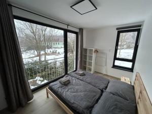 מיטה או מיטות בחדר ב-Horský dům Vojta
