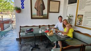 a man and woman sitting at a table in a restaurant at Solomon's Mansion Hotel Istanbul in Istanbul