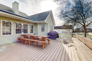 a wooden deck with a picnic table and chairs at 12 Doolin Ln in Rehoboth Beach