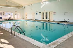 a large swimming pool with blue water at 12 Doolin Ln in Rehoboth Beach