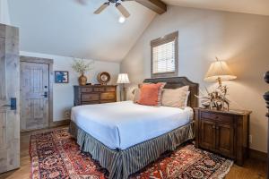 a bedroom with a bed and a rug at Serenity in the Valley in Jackson