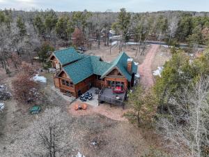 an overhead view of a log cabin with a green roof at Lake Tower Lodge in New Rome