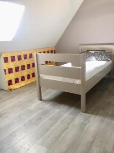 a white bunk bed in a attic room at Manoir De Saint Ceran Au Royaume De Louango in Lanrivain