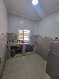 a large bathroom with a sink and a counter at Residence wolf and gang in Nouakchott