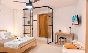 Postel nebo postele na pokoji v ubytování Sun Stone Villas