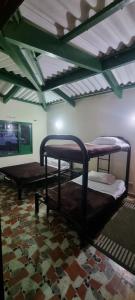 two bunk beds in a room with a ceiling at CQ SANTA ANA in San Antonio del Tequendama