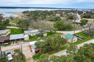 an aerial view of a small town with a body of water at Pet-Friendly Brownwood Home Walk to Lake! in Lake Brownwood