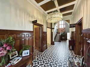 a large hallway with a lobby with a lobby at Welbeck Manor and Golf in Plymouth