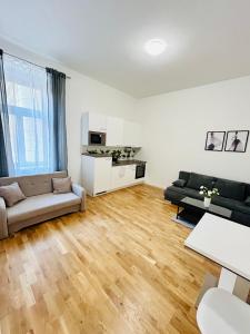 a living room with a couch and a table at Helen Homestay 50m from Wenceslas Square in Prague