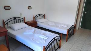 Postel nebo postele na pokoji v ubytování Τζαννής Αγλαΐα
