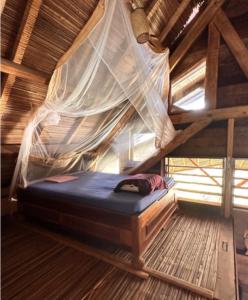 Giường trong phòng chung tại Shambala Madagascar