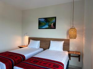Postel nebo postele na pokoji v ubytování Oneiro Suites with Sea View