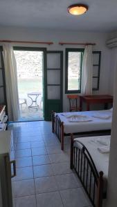 Postel nebo postele na pokoji v ubytování Τζαννής Αγλαΐα