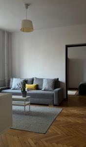 a living room with a couch and a table at Apartament K3 in Warsaw