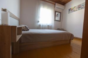 A bed or beds in a room at SOFIA'S HOUSE