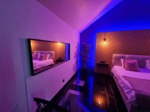 Postel nebo postele na pokoji v ubytování Suite Wellness
