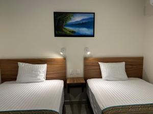 Postel nebo postele na pokoji v ubytování Oneiro Suites with Sea View