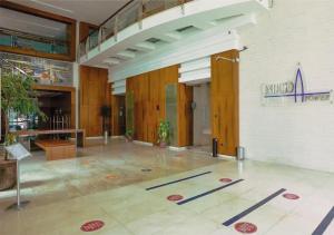 an empty lobby with a table in a building at Astonishing 1 Bedroom in Jumeirah Lake Towers in Dubai