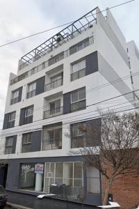 a white building with a lot of windows at ALTOS DE CLERMONT in Cordoba
