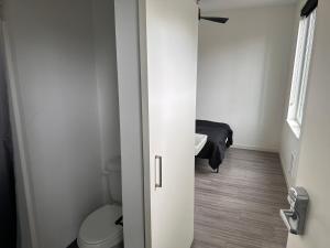a bathroom with a toilet and a sink at Private Apartment in Portland in Portland