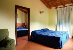 Cama o camas de una habitación en Hotel Ibaigune