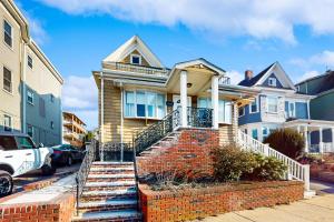 a house with a staircase in front of it at In-between the Coast and the City in Everett