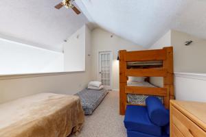 a bedroom with a bunk bed and a ladder at Winterplace Getaway in Ludlow +24 photos