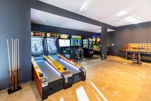 a row of pinball machines in a room at Renaissance Denver Hotel & Conference Center in Denver