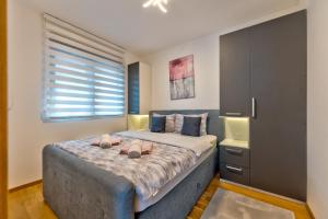 Postel nebo postele na pokoji v ubytování VM apartmani