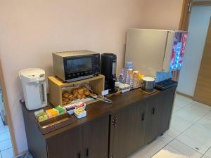 Kuchyň nebo kuchyňský kout v ubytování Hotel Sakurano Familia Nago