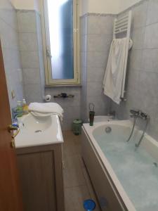 a bathroom with a tub and a sink and a bath tub at Vatican Trastevere house Rome in Rome