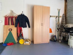 a room with a wooden cabinet and somecellaneous items at Tekapo Haven - Lake Tekapo in Lake Tekapo