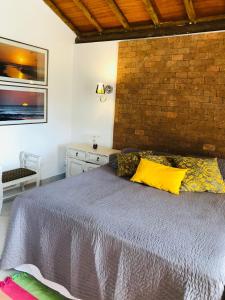 Ένα ή περισσότερα κρεβάτια σε δωμάτιο στο Canto da Seriema - Chalé 1