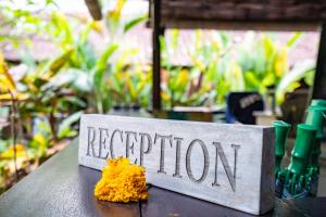 a sign that says repetition sitting on a table at Meruhdani Boutique Hotel Ubud in Ubud