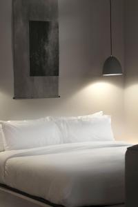 Postel nebo postele na pokoji v ubytování kodō hotel