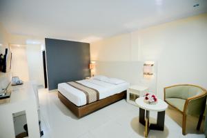 Krevet ili kreveti u jedinici u okviru objekta Cakra Kusuma Hotel