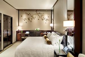Letto o letti in una camera di The Peninsula Hong Kong