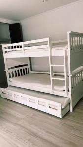 two white bunk beds in a room at 1日1組限定　和洋折衷 EDOYA in Chiba