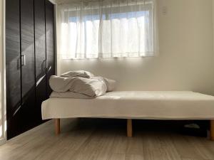 Una cama o camas en una habitación de 1日1組限定　和洋折衷 EDOYA
