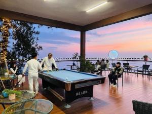 a group of people playing pool on a deck at Ruby Tam Đảo in Tam Ðảo