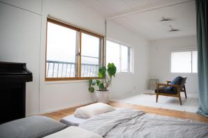 Giường trong phòng chung tại 【湯布院の山小屋】サンクラウド・ヒュッテ +28 ảnh