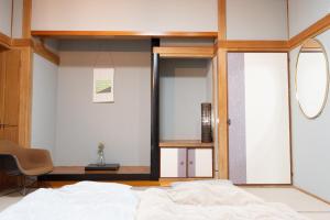 Gulta vai gultas numurā naktsmītnē 【湯布院の山小屋】サンクラウド・ヒュッテ
