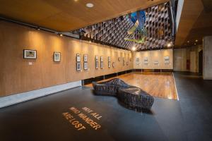 a museum with a sculpture on the floor in a room at ARTOTEL Sanur Bali in Sanur +40 photos