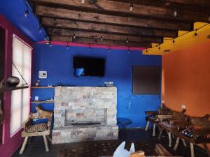 TV a/nebo společenská místnost v ubytování Casa azul